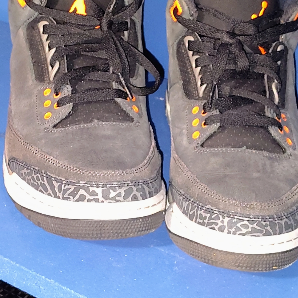 Jordan Black and Orange Mid-Top Sneakers with Speckled Pattern
